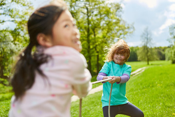 Two girls enjoy tug of war