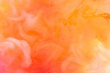 Paints dissolved in water with a beautiful spectacular blur. Trending neon colors. Bright amazing abstract background. Smoke effect.