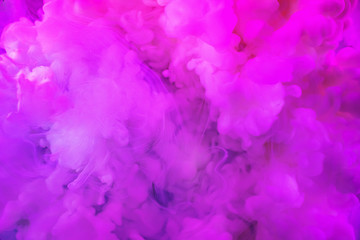 Fototapeta na wymiar Paints dissolved in water with a beautiful spectacular blur. Trending neon purple colors. Bright amazing abstract background. Smoke effect.