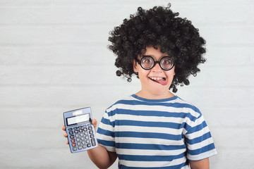 funny child with calculator wearing nerd glasses