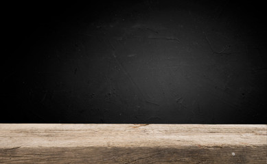 Empty wood table top on blur light gold bokeh of cafe restaurant in dark background