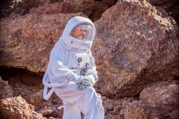 Astronaut spaceman Standing on the Rocky Mountain of the Alien Red   Planet/ Mars. First Manned...