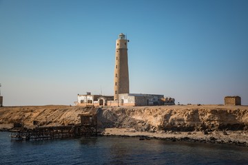 Tall lighthouse on the sea