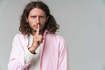 Close up of a young long haired man wearing shirt