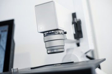White microscope close-up photo inside laboratory