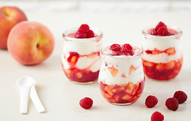 Peach and raspberry dessert with yogurt cream