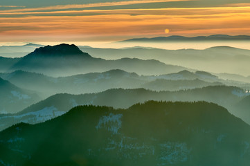Aerial Landscape view from Ceahlău Mountains National Park at sunset in winter season,Sunset in Ceahlau Mountains