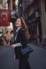 Beautiful woman walks at Istiklal street, Istambul