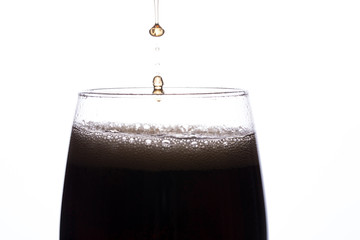 drink in a glass with ice on a white background