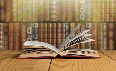 Open book on old wooden table