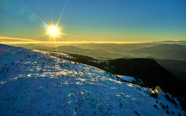 Aerial Landscape view from Ceahlău Mountains National Park at sunset in winter season,Sunset in Ceahlau Mountains
