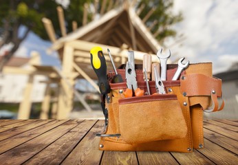 Tool belt with tools on light background