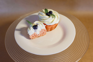 cupcakes with blueberries and blueberries on a plate