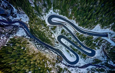 Foto op Aluminium Aerial drone view of a serpentine in rocky mountain forest, Bicaz gorge with winding road in winter season,Cheile Bicazului, Romania © DannyIacob