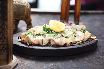 Chicken malai tikka on a hot dish