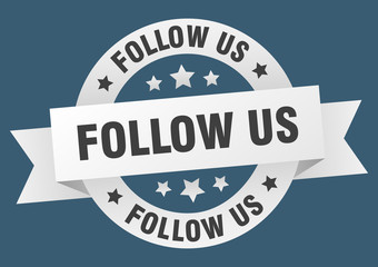 Obraz premium follow us ribbon. follow us round white sign. follow us