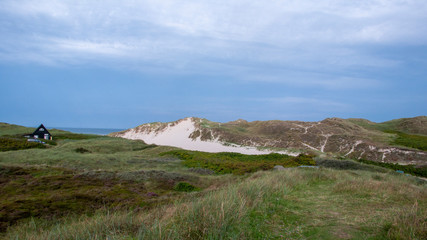 landscape lonely huse with rocks and blue sky 