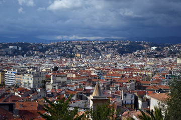 Fototapeta premium Nice, France - february 11th 2018 : cityscape of Nice during a thunderstorm, with sun