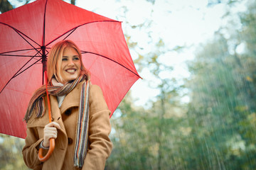 Nice young woman enjoy in rain. I like a rain !