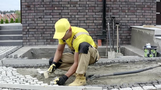 Construction Industry. Garden Development. Building Granite Paved Hardstanding Garden Path