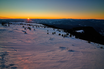 Aerial Landscape view from Ceahlău Mountains National Park at sunset in winter season,Sunset in Ceahlau Mountains