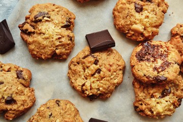 Oatmeal cookies with chocolate. Cookies on a light background with parchment.