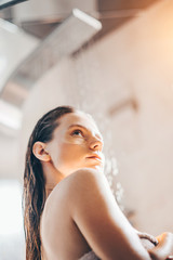 Portrait of Beauty woman with eye patches showing an effect of perfect skin. Beautiful face of young adult woman with clean fresh skin