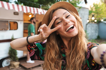 Cheerful young girl taking a selfie