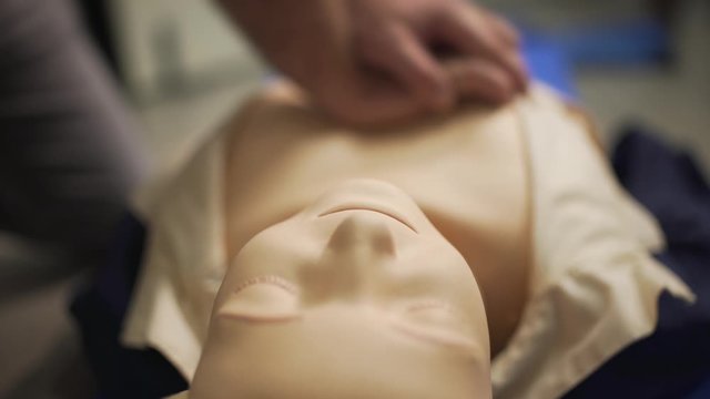 Closeup of first aid CPR doll dummy for cardio-pulmonary reanimation training. Bottom view.
