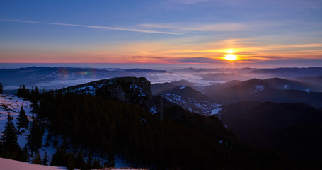 Amazing sunrise view from Ceahlău Mountains National in winter season, Winter Landscape in National Park Ceahlau
