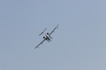 A colorful military fighter jet flying in the sky