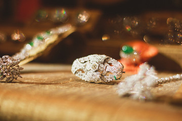 Close up of luxurious broach with diamonds and blurred back