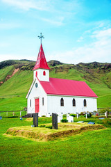 Fototapeta na wymiar Magical majestic picturesque cozy little church nearby Stokksnes, Iceland. Exotic countries. Amazing places.