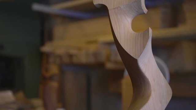 Tilt down of a historic forcola, a wooden oarlock for gondolas, the traditional boats in Venice, Venezia. 