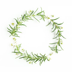 Round wreath frame made of mix of herbs, green branches, leaves rosemary and thyme. Set of medicinal herbs. Flat lay. Top view.