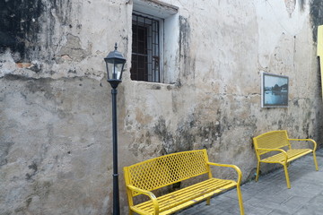 chair in front of brick wall