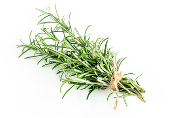 Green bundle of rosemary isolated on a white background. Мedicinal herbs. Flat lay. Top view