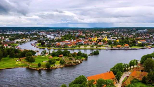 Fredrikstad, Norway. Aerial view of Glomma river in Fredrikstad, Norway with famous landmarks like Isegran Fort. Time-lapse with moving boats and clouds, zoom in