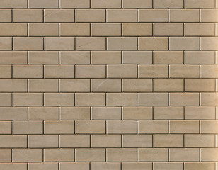Beige textured brick wall with stains and scratches. Modern texture trendy abstract background