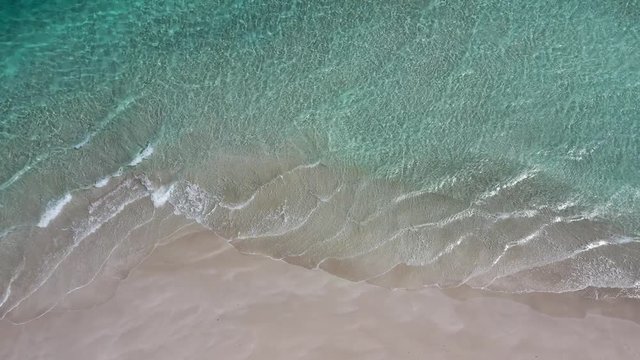 Aerial video footage of sea, surf and beach 