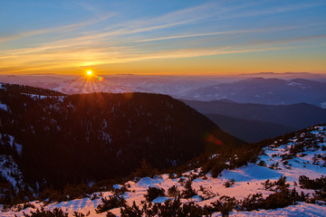 Amazing sunset view from Ceahlău Mountains National in winter season,Aerial winter Landscape