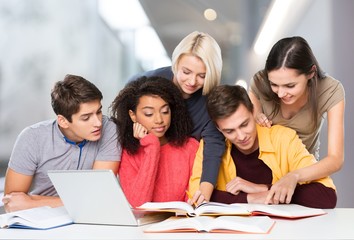 Four Young students studying subject on background