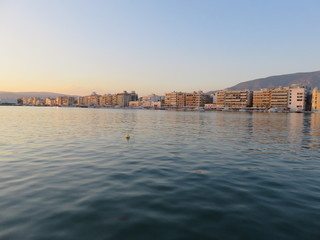 Fototapeta premium Calm sea at city harbor
