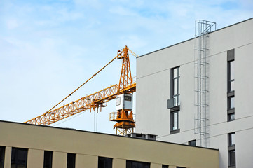 Crane and highrise construction site