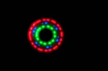 Green blue red circle formed by the movement of the luminous spinner