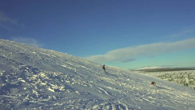 Slow motion footage of two skiers on slight slope at Vemdalen, vemdalskalet, storhogna klovsjo, Sweden