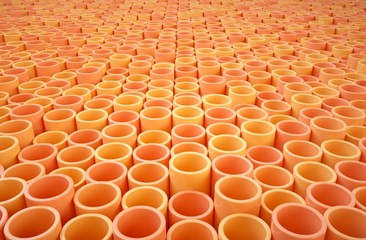 Fototapeta premium Orange tubes of different shades.