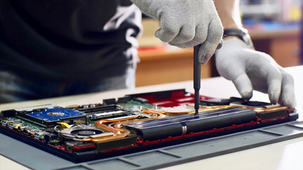Repairs and diagnostics breakdowns of laptop in professional service center. Electronic master...