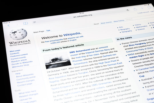 BUCHAREST, ROMANIA - DECEMBER 09, 2014: Wikipedia Website On Apple iPad Air Tablet. Wikipedia is a free-access and free content encyclopedia and is the Internet largest general reference work.