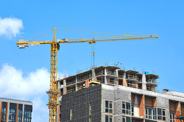 Crane and highrise construction site